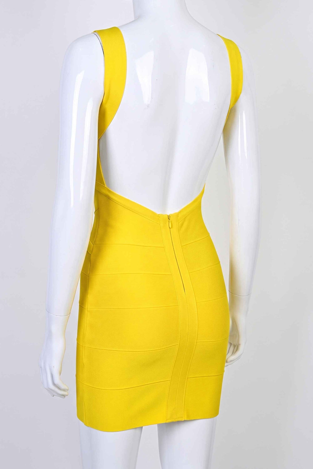 Woman wearing a figure flattering Maya Bandage Mini Dress - Sun Yellow BODYCON COLLECTION