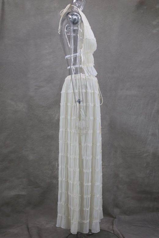 Woman wearing a figure flattering  Meryl Wrap Top and Maxi Skirt Set - Cream BODYCON COLLECTION