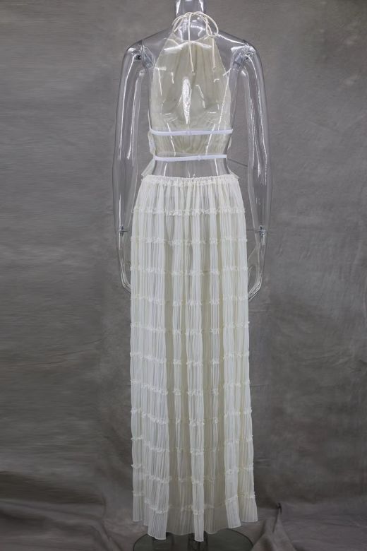 Woman wearing a figure flattering Meryl Wrap Top and Maxi Skirt Set - Cream BODYCON COLLECTION