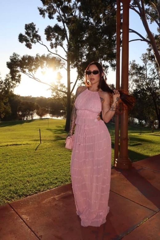 Woman wearing a figure flattering Meryl Wrap Top and Maxi Skirt Set - Cream BODYCON COLLECTION