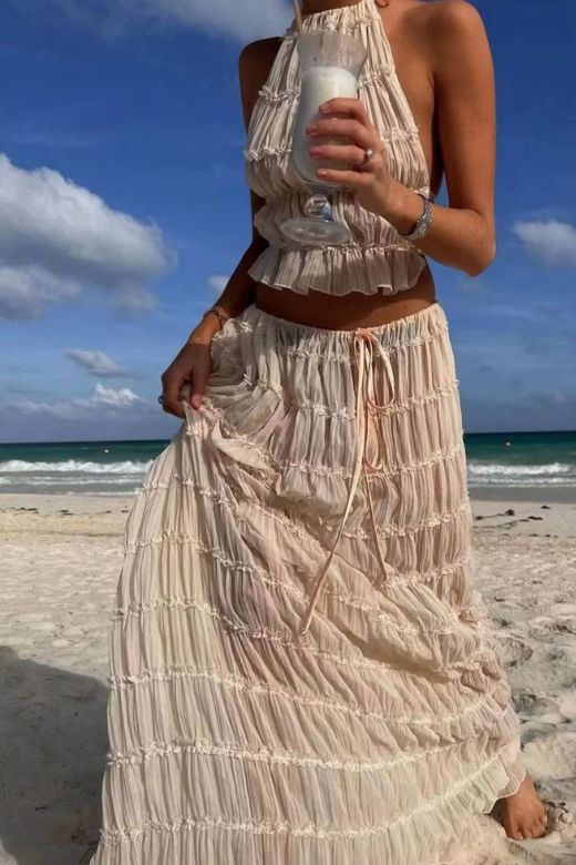 Woman wearing a figure flattering  Meryl Wrap Top and Maxi Skirt Set - Pink Fuzz BODYCON COLLECTION
