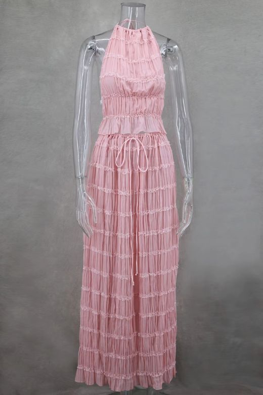 Woman wearing a figure flattering  Meryl Wrap Top and Maxi Skirt Set - Pink Fuzz BODYCON COLLECTION