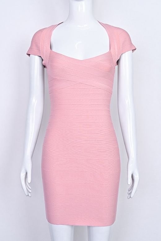 Woman wearing a figure flattering Miranda Bandage Mini Dress - Ballet Pink Bodycon Collection