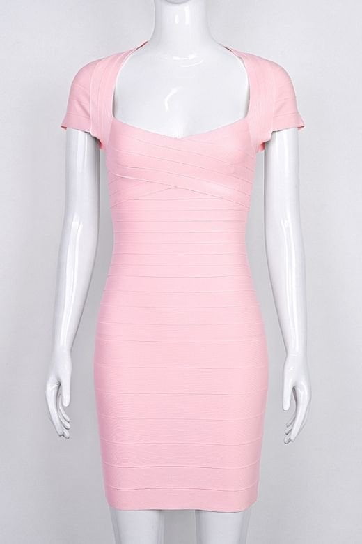 Woman wearing a figure flattering Miranda Bandage Mini Dress - Dusty Pink Bodycon Collection