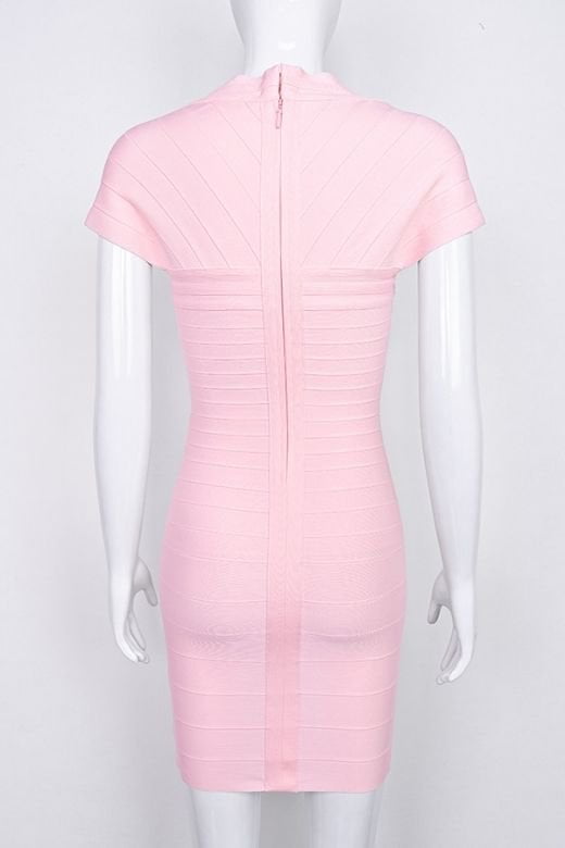 Woman wearing a figure flattering Miranda Bandage Mini Dress - Dusty Pink Bodycon Collection