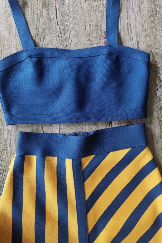 Woman wearing a figure flattering Nadia Bandage Crop Top and Midi Skirt Set - Royal Blue BODYCON COLLECTION