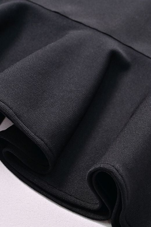 Woman wearing a figure flattering Nora Bandage Midi Dress - Classic Black BODYCON COLLECTION