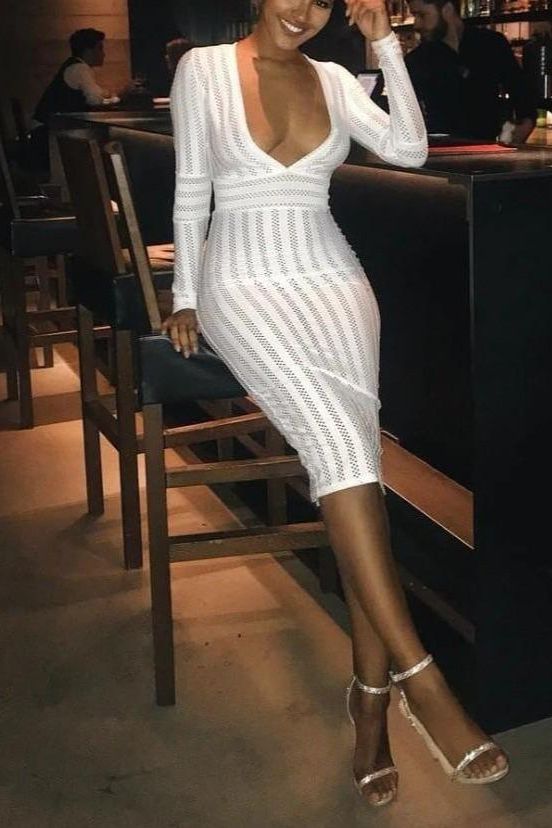 Woman wearing a figure flattering Olivia Long Sleeve Bandage Midi Dress - Pearl White Bodycon Collection