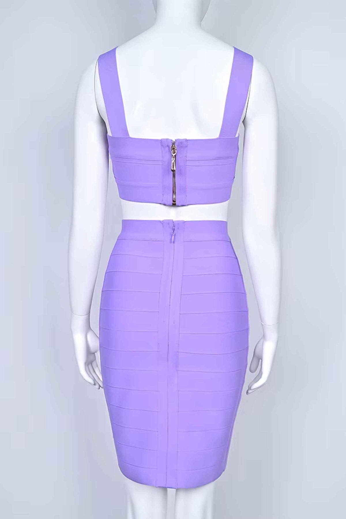 Woman wearing a figure flattering Ophelia Bandage Crop Top and Skirt Set - Violet BODYCON COLLECTION Pty Ltd