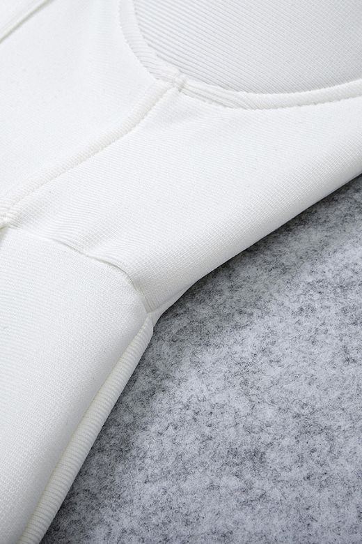 Woman wearing a figure flattering Payton Bandage Dress - Pearl White BODYCON COLLECTION