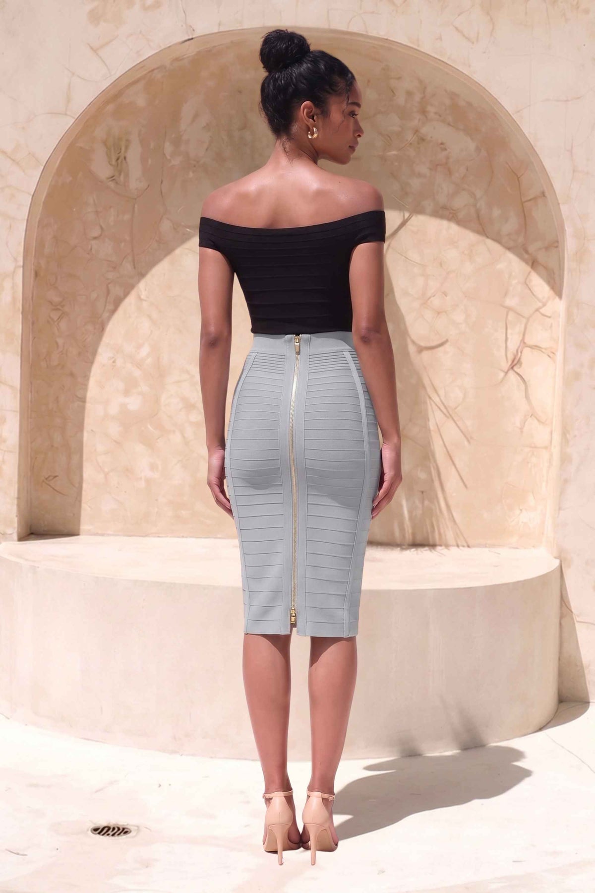 Woman wearing a figure flattering Pencil High Waist Bandage Knee Length Knitted Skirt - Steel Grey BODYCON COLLECTION