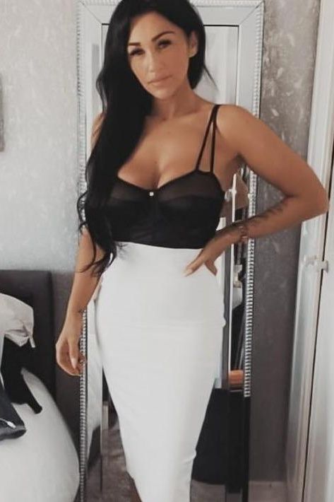 Woman wearing a figure flattering Pencil High Waist Bandage Midi Skirt - Pearl White BODYCON COLLECTION