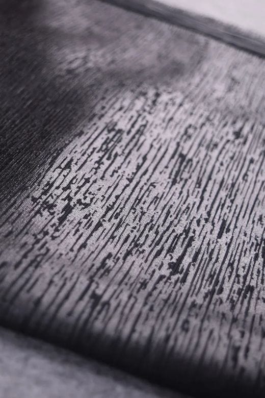 Woman wearing a figure flattering Pencil High Waist Leather Metallic Midi Skirt - Classic Black BODYCON COLLECTION