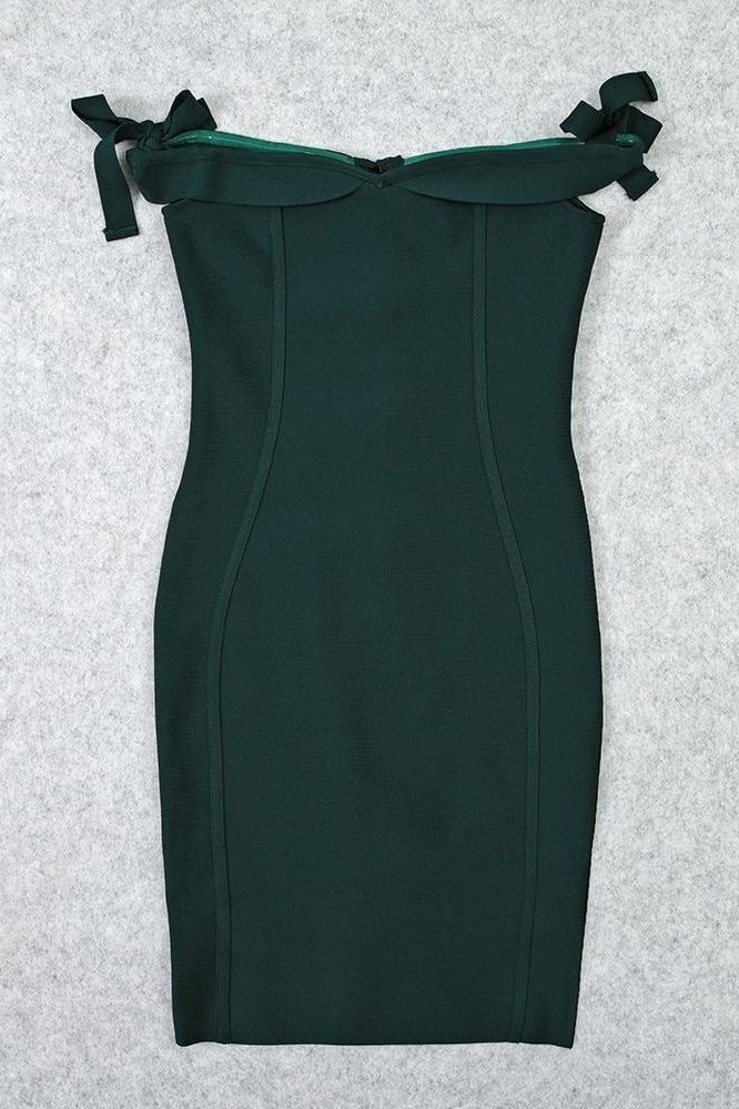 Woman wearing a figure flattering  Penelope Bandage Miini Dress - Emerald Green BODYCON COLLECTION