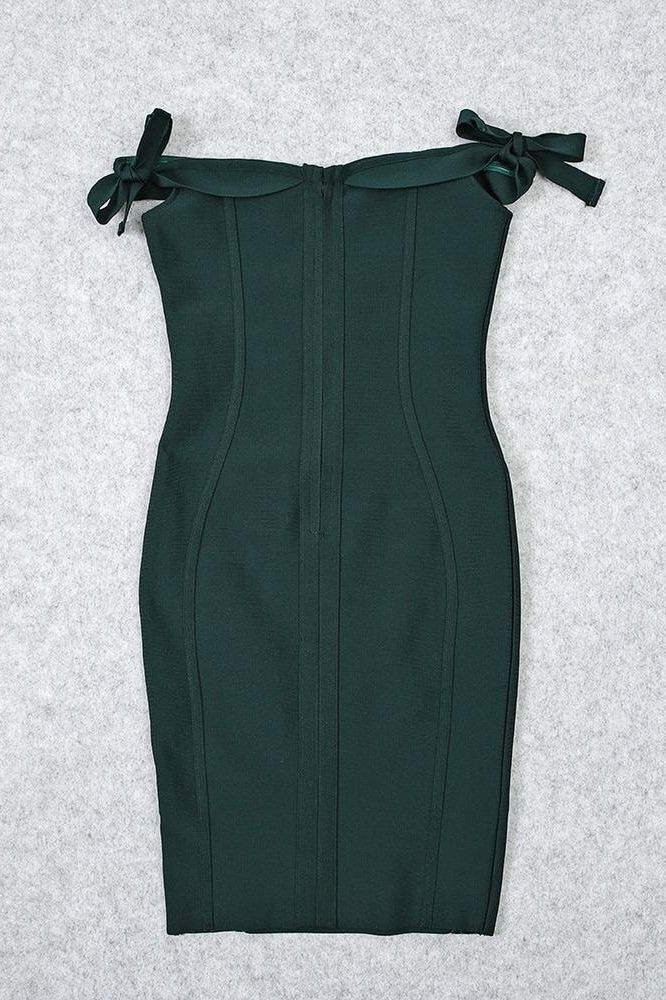 Woman wearing a figure flattering  Penelope Bandage Miini Dress - Emerald Green BODYCON COLLECTION