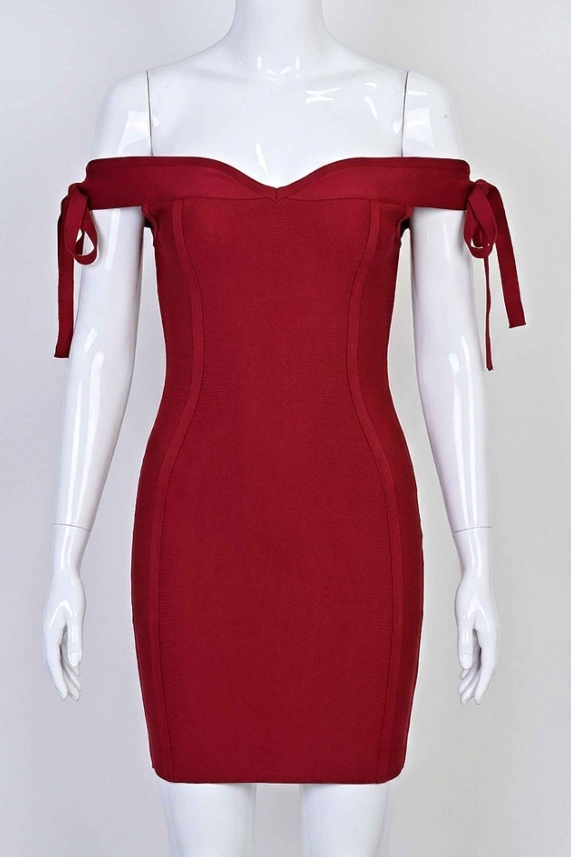 Woman wearing a figure flattering Penelope Bandage Mini Dress - Red Wine BODYCON COLLECTION