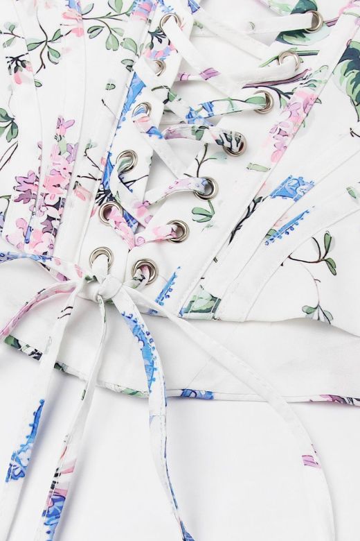 Woman wearing a figure flattering Penny Corset Top - White Floral BODYCON COLLECTION Pty Ltd