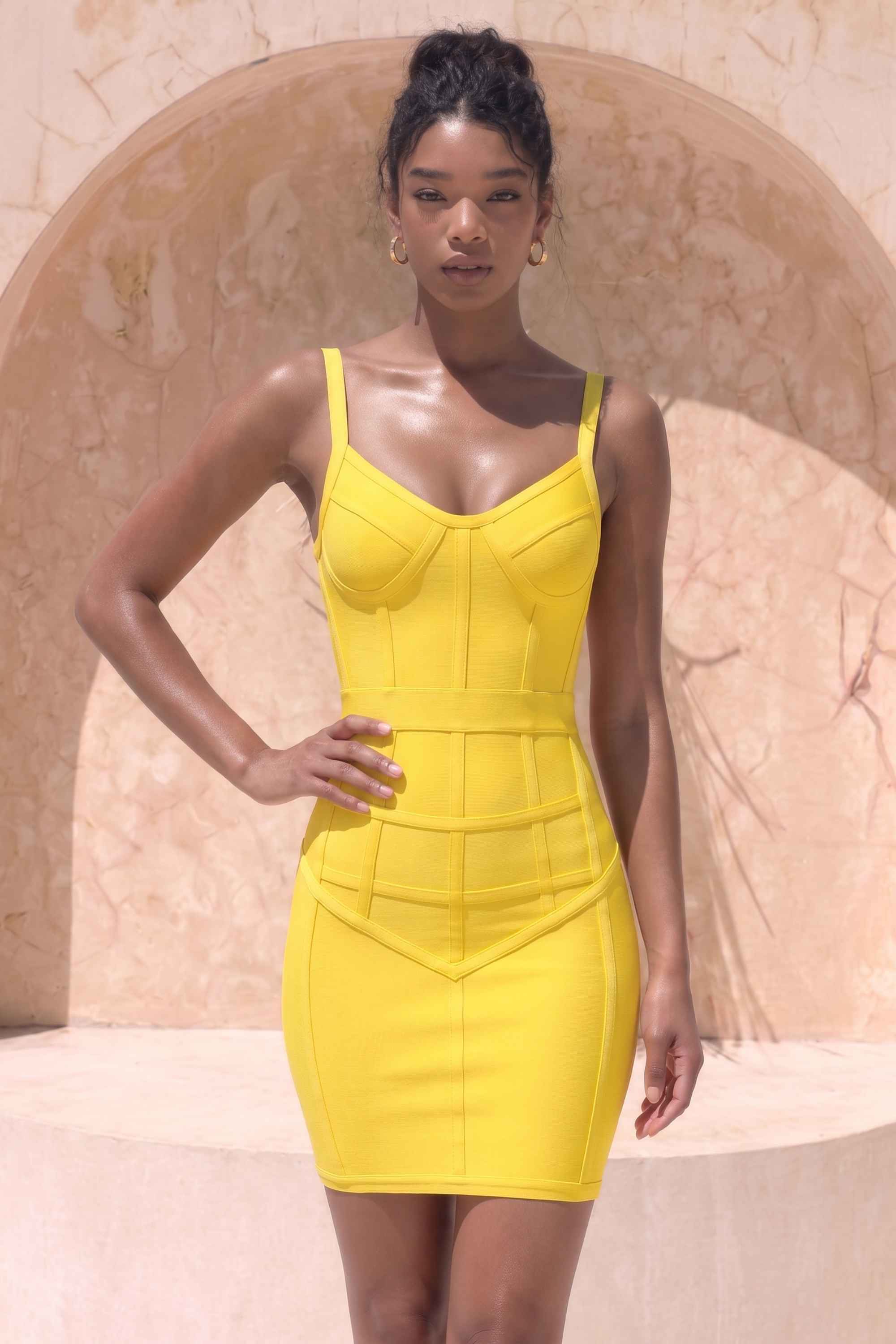Woman wearing a figure flattering Pip Bandage Mini Dress - Sun Yellow BODYCON COLLECTION