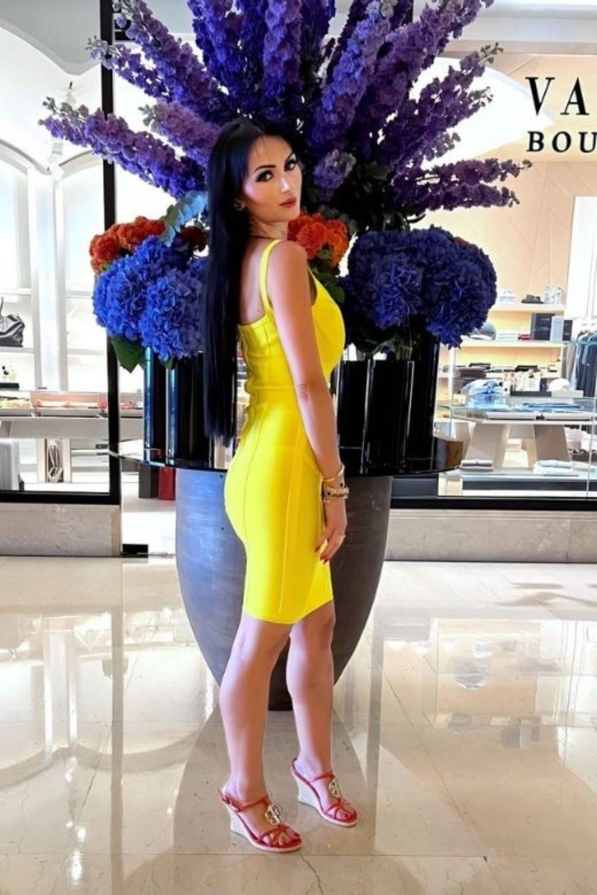 Woman wearing a figure flattering Pip Bandage Mini Dress - Sun Yellow BODYCON COLLECTION