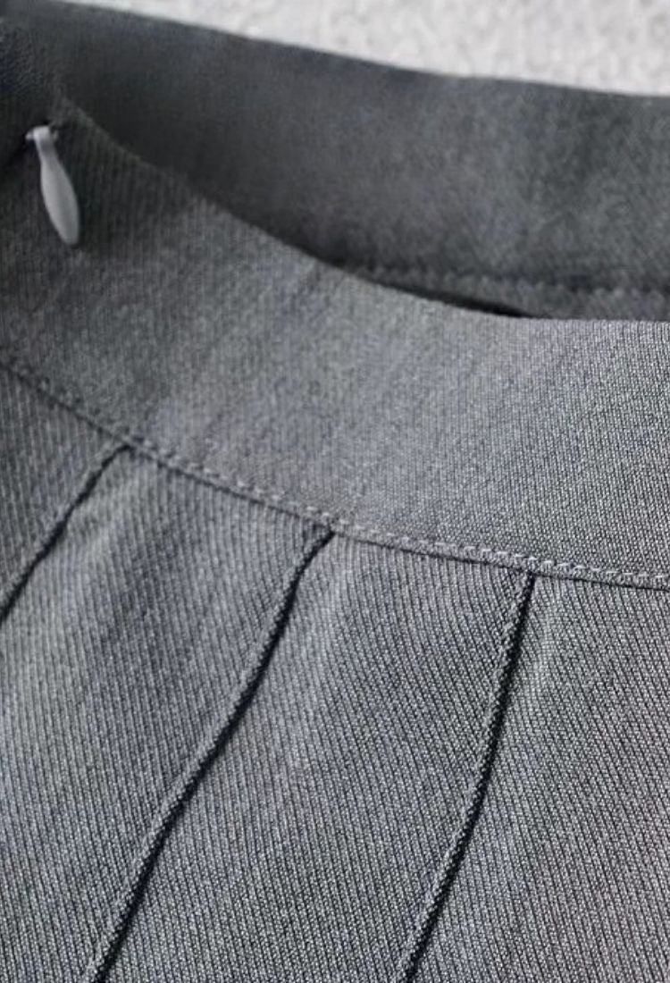 Woman wearing a figure flattering Pleated Mini Skirt - Tan Brown BODYCON COLLECTION Pty Ltd