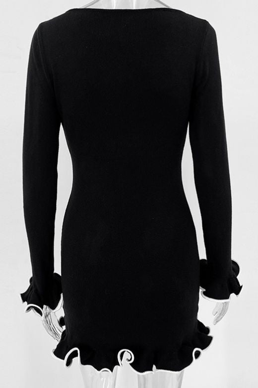 Woman wearing a figure flattering Regina Long Sleeve Bodycon Mini Dress - Classic Black BODYCON COLLECTION