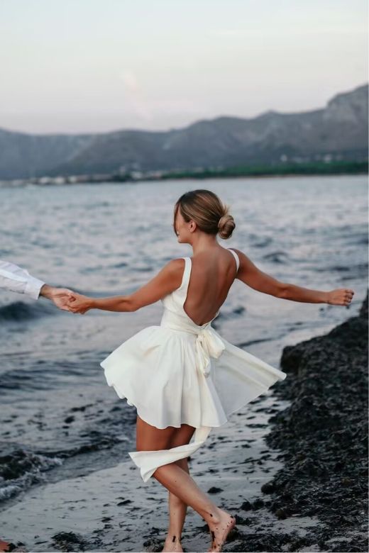 Woman wearing a figure flattering Rian Bodycon Mini Dress - Classic Black BODYCON COLLECTION