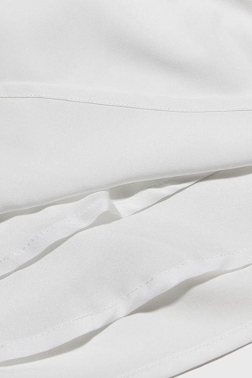 Woman wearing a figure flattering Rian Bodycon Mini Dress - Pearl White BODYCON COLLECTION