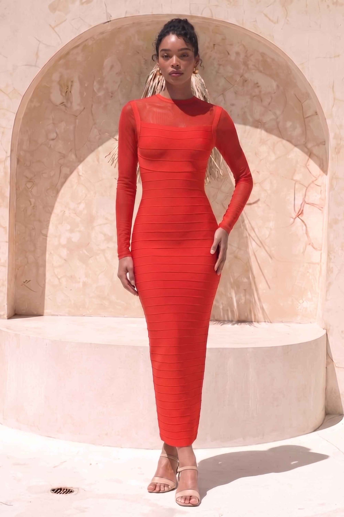 Woman wearing a figure flattering Robin Long Sleeve Bandage Maxi Dress - Lipstick Red BODYCON COLLECTION Pty Ltd