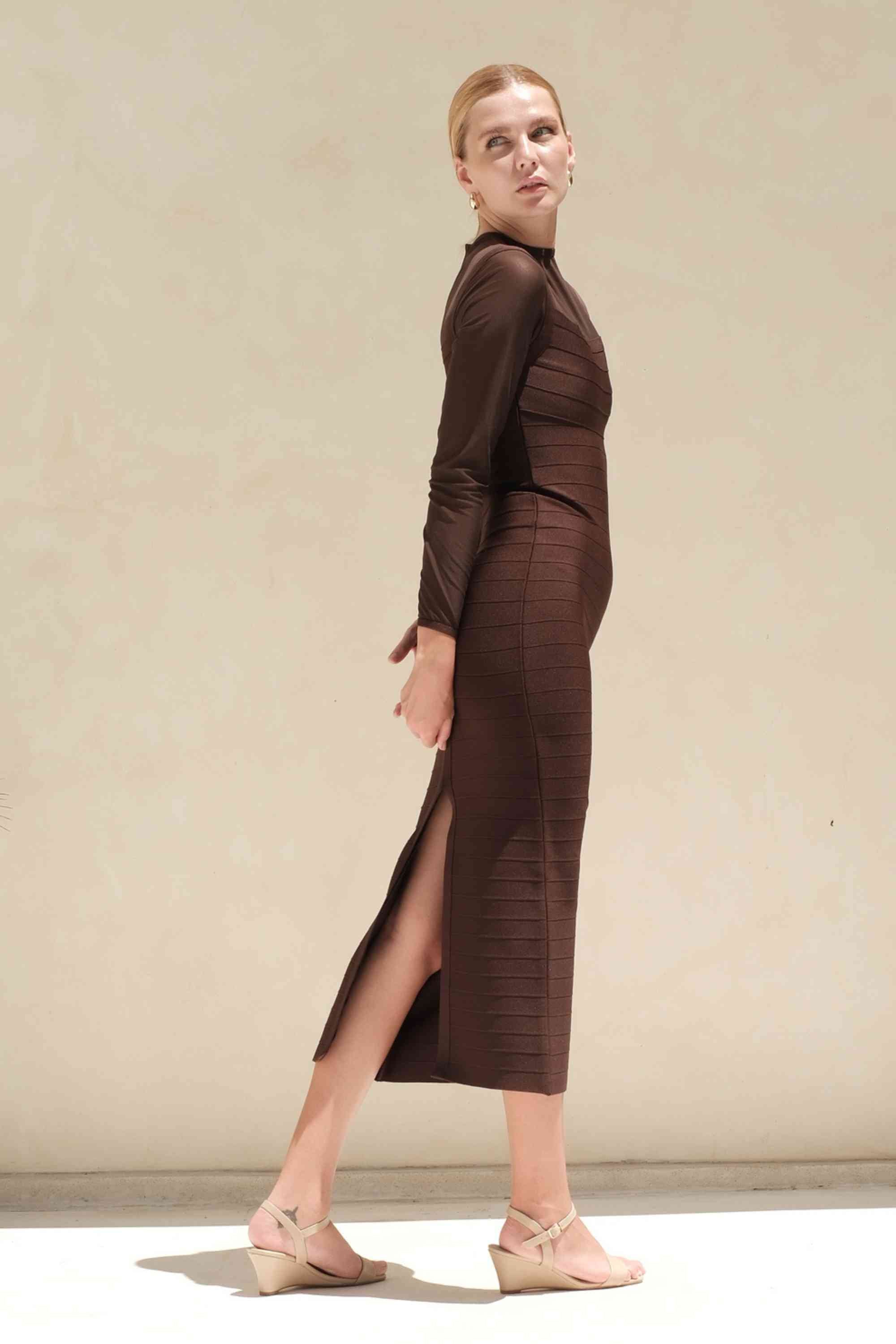 Woman wearing a figure flattering Robin Long Sleeve Bandage Maxi Dress - Tan Brown BODYCON COLLECTION Pty Ltd