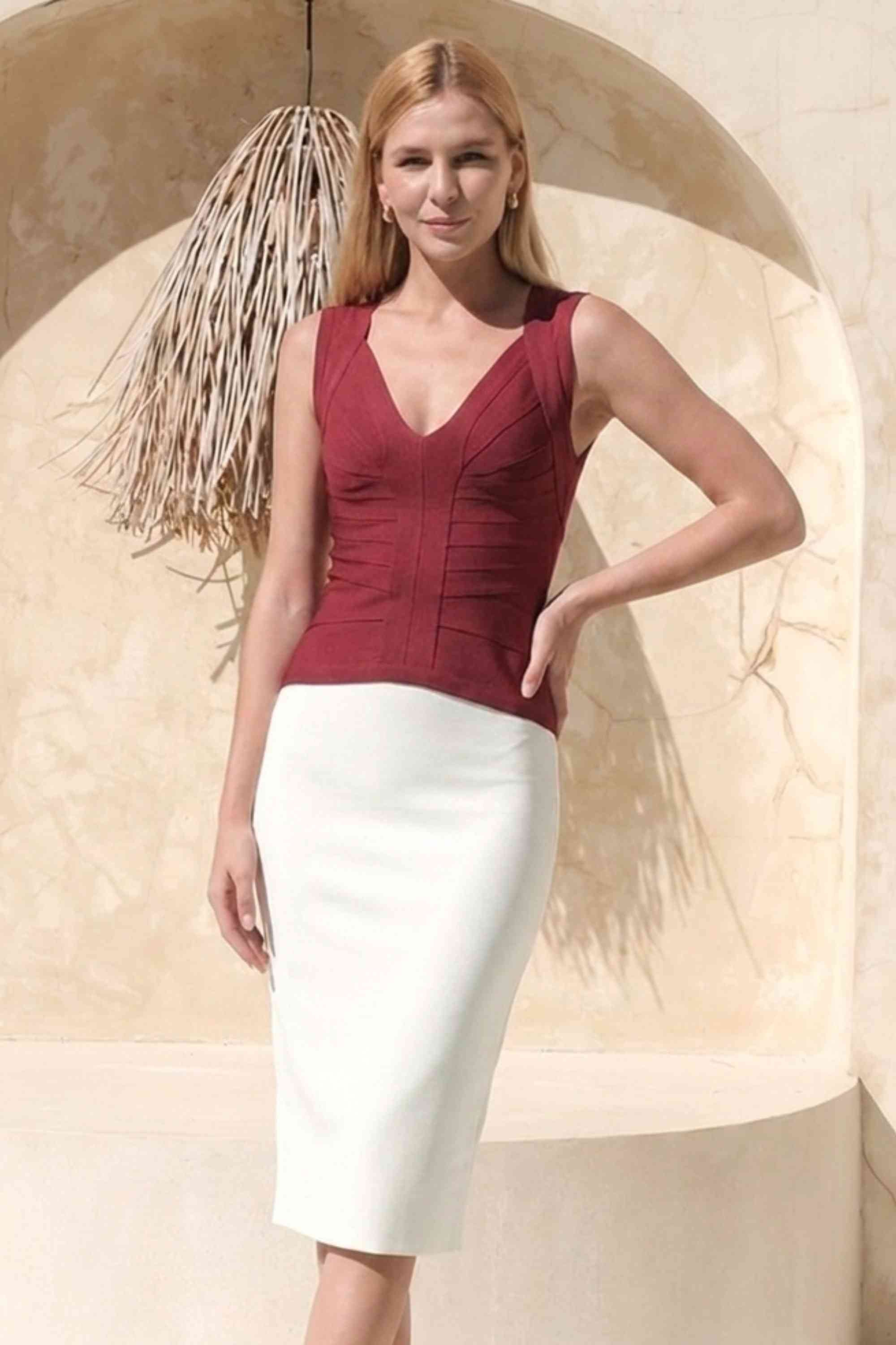 Woman wearing a figure flattering Sabrina Bandage Top - Red Wine BODYCON COLLECTION Pty Ltd