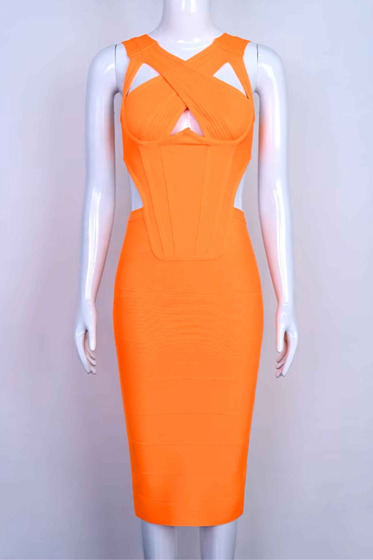Woman wearing a figure flattering Sasha Bandage Midi Dress - Apricot Orange BODYCON COLLECTION