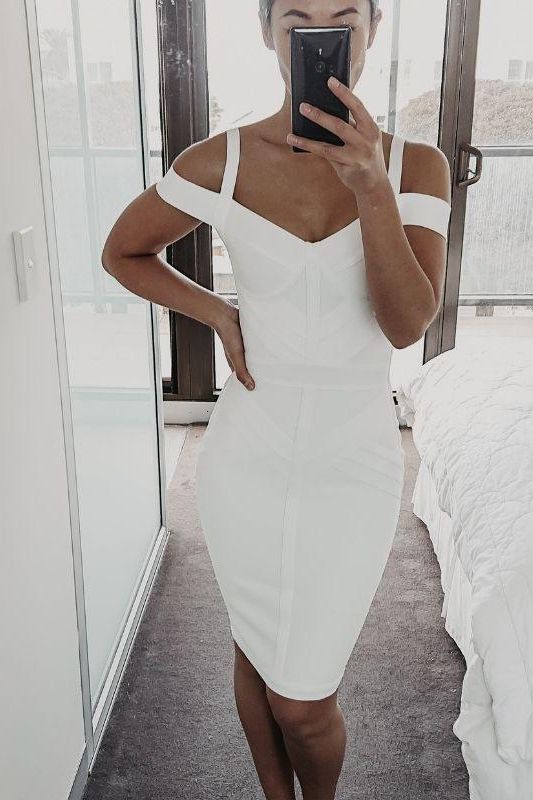 Woman wearing a figure flattering Sophia Bandage Dress - Pearl White Bodycon Collection