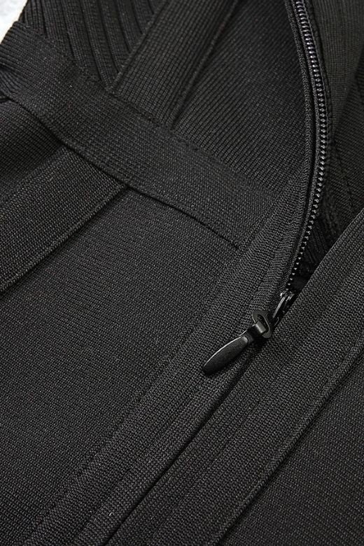 Woman wearing a figure flattering Sophia Bandage Mini Dress - Classic Black Bodycon Collection