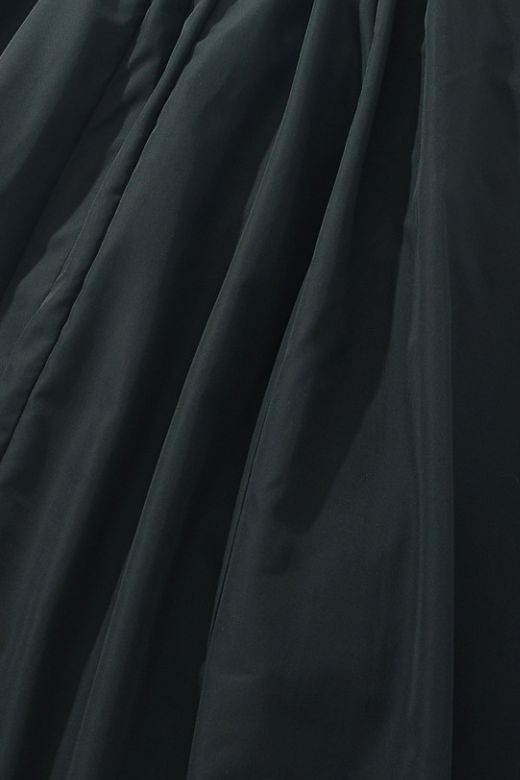 Woman wearing a figure flattering Stella Bodycon Midi Dress - Classic Black BODYCON COLLECTION