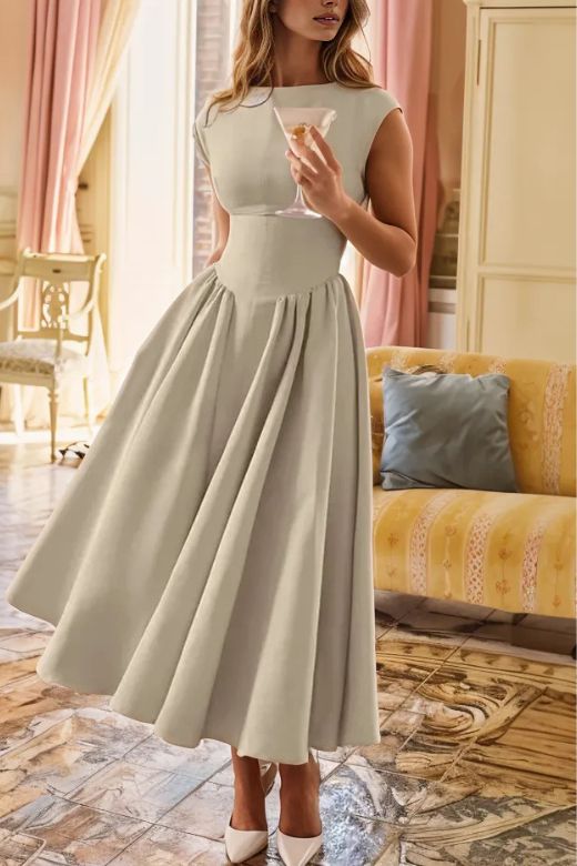 Woman wearing a figure flattering Stella Bodycon Midi Dress - Cream BODYCON COLLECTION