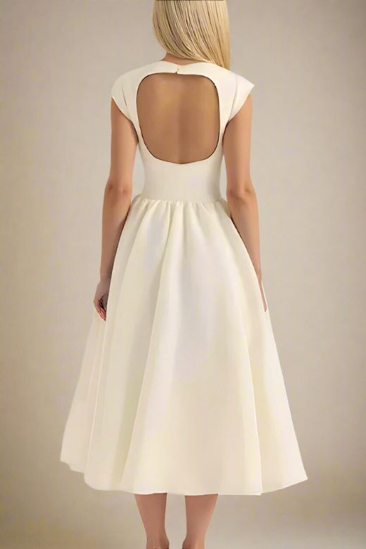 Woman wearing a figure flattering Stella Bodycon Midi Dress - Ivory White BODYCON COLLECTION