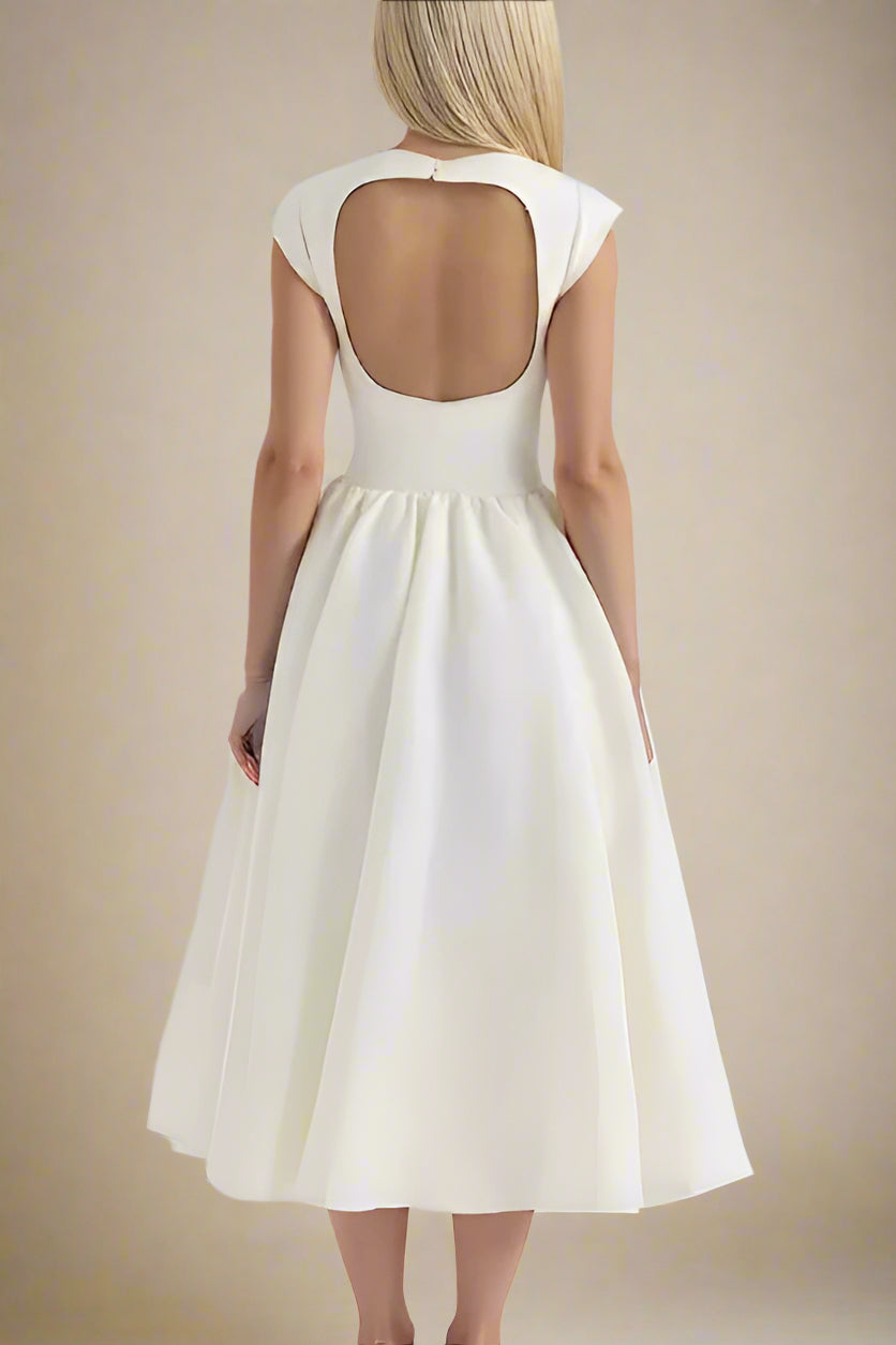 Woman wearing a figure flattering Stella Bodycon Midi Dress - White Pearl BODYCON COLLECTION