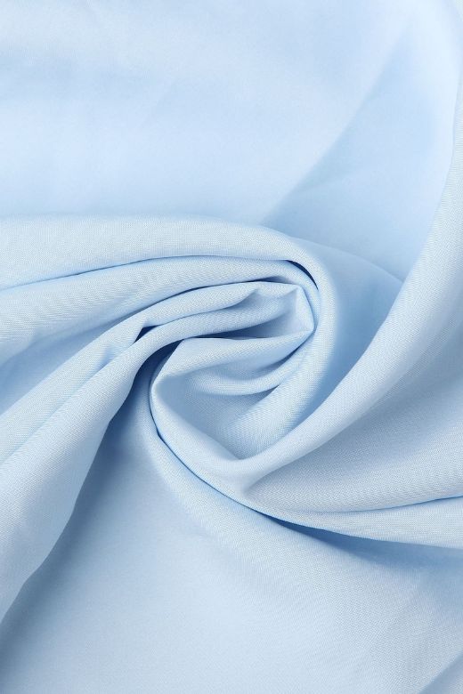 Woman wearing a figure flattering Tasmin Bodycon Midi Dress - Sky Blue BODYCON COLLECTION