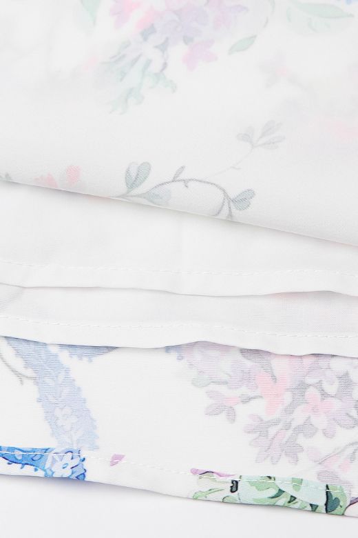 Woman wearing a figure flattering Tasmin Bodycon Midi Dress - White Floral BODYCON COLLECTION