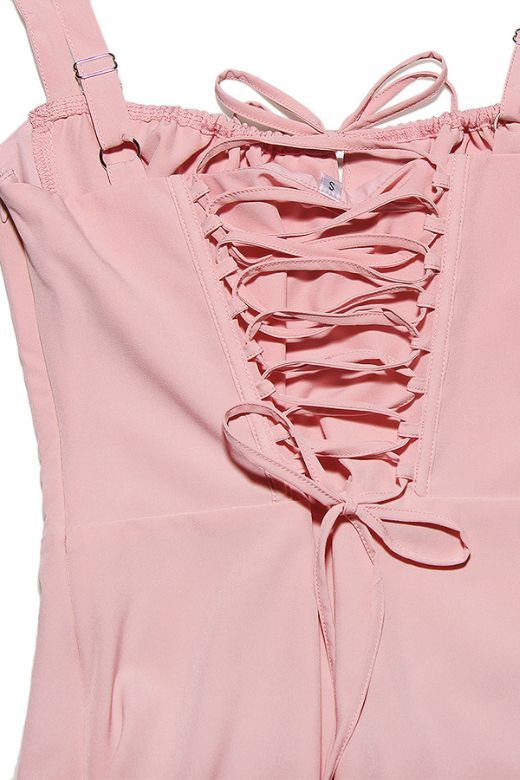 Woman wearing a figure flattering Taylor Bodycon Day Mini Dress - Dusty Pink BODYCON COLLECTION