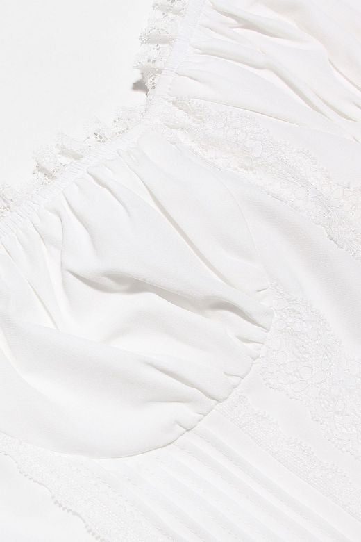 Woman wearing a figure flattering Valerie Corset Crop Top - Pearl White BODYCON COLLECTION