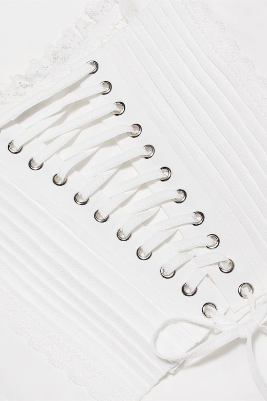 Woman wearing a figure flattering Valerie Corset Crop Top - Pearl White BODYCON COLLECTION