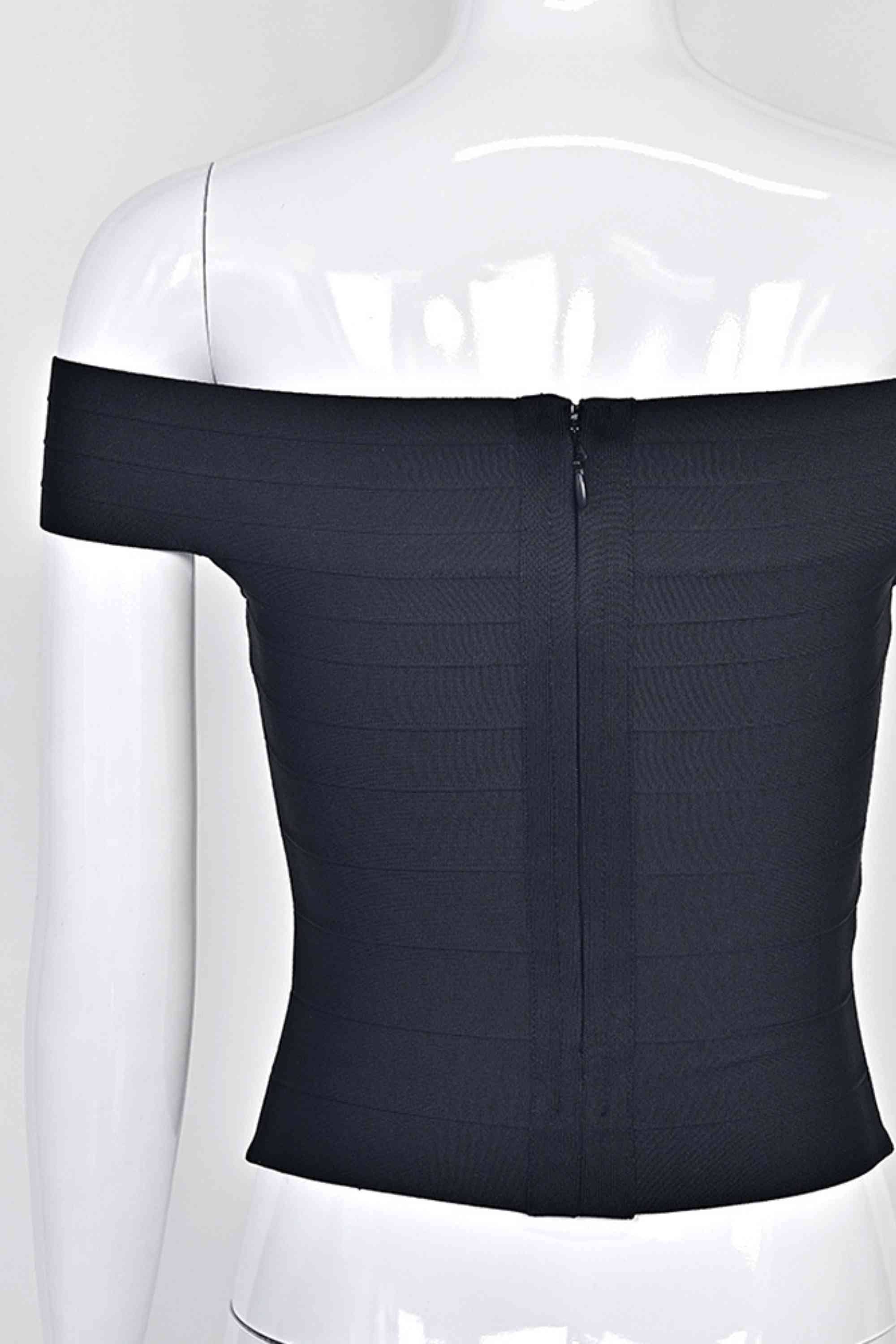 Woman wearing a figure flattering Vera Bandage Off Shoulder Top - Classic Black BODYCON COLLECTION Pty Ltd