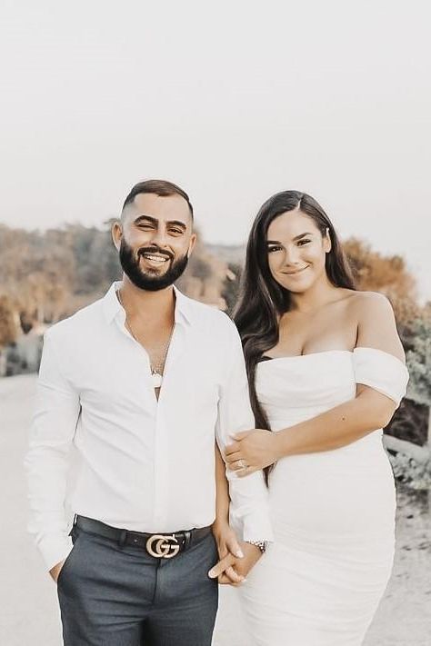 Woman wearing a figure flattering Zia Bodycon Wrap Midi Dress - Violet Bodycon Collection