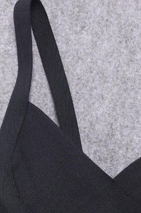 Woman wearing a figure flattering Bek Bandage Dress - Classic Black Bodycon Collection