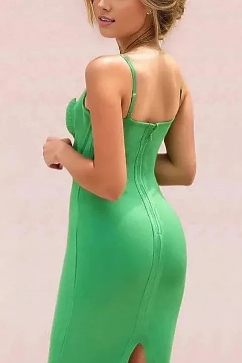 Woman wearing a figure flattering  Ariel Bandage Dress - Emerald Green BODYCON COLLECTION