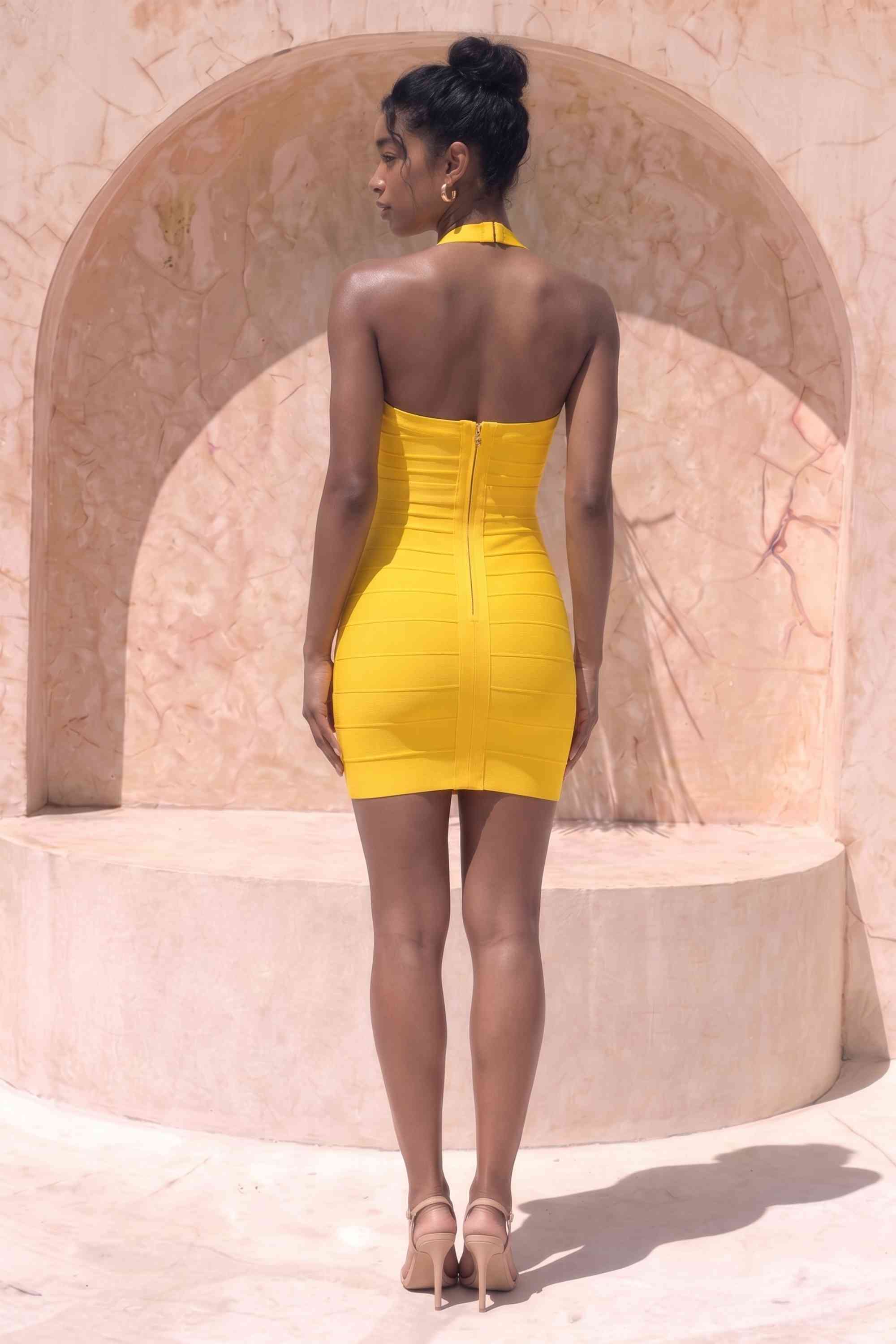 Woman wearing a figure flattering  Athena Bandage Mini Dress - Mustard Yellow BODYCON COLLECTION Pty Ltd
