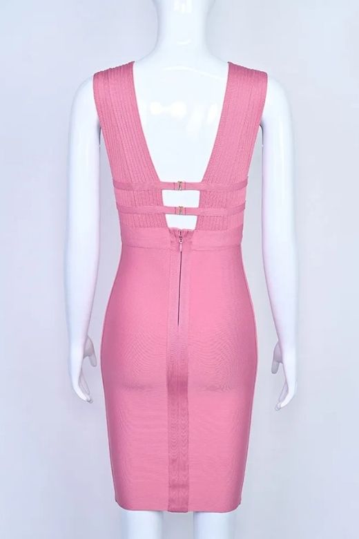 Woman wearing a figure flattering  Bay Bandage Dress - Ballet Pink Bodycon Collection
