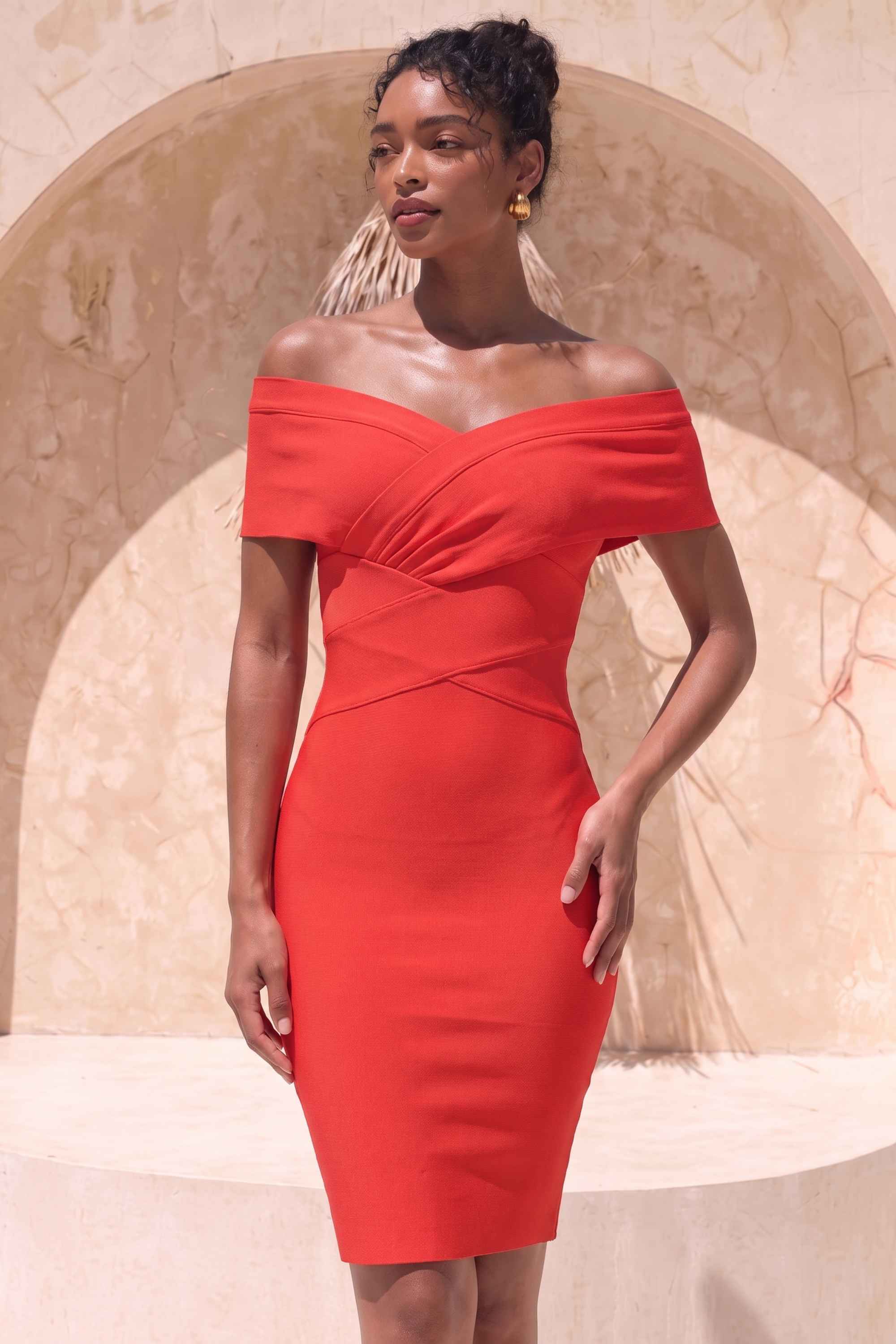 Woman wearing a figure flattering  Bea Bandage Dress - Lipstick Red Bodycon Collection