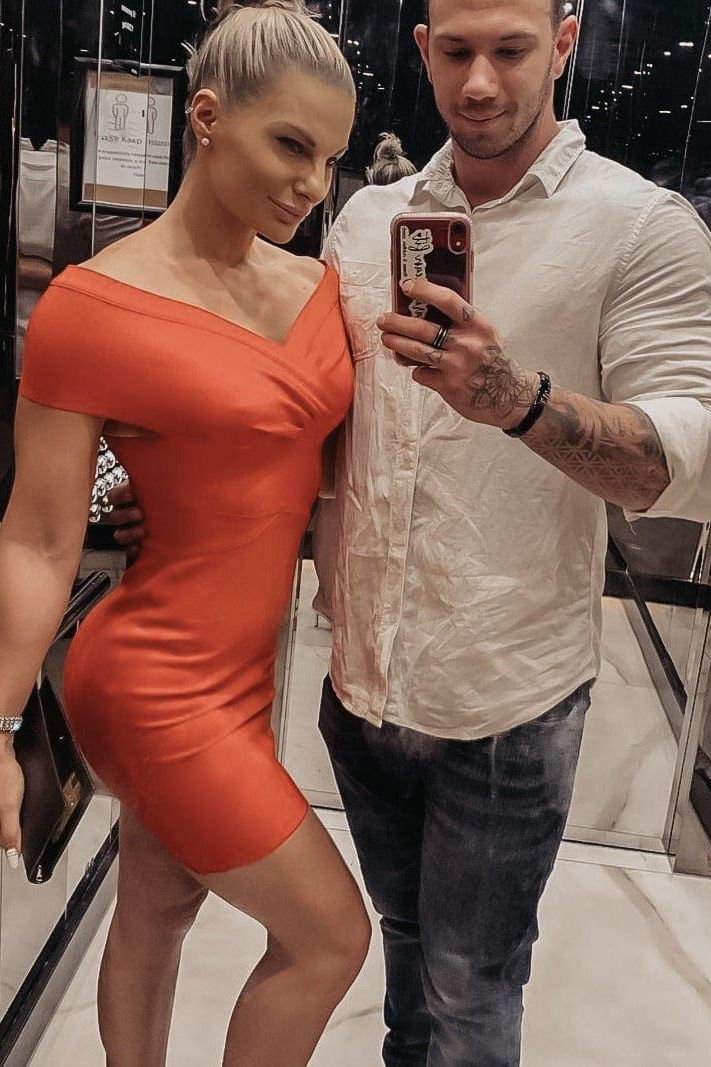 Woman wearing a figure flattering  Bea Bandage Dress - Lipstick Red Bodycon Collection